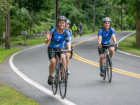 Tour de Greenbelt riders waving to camera